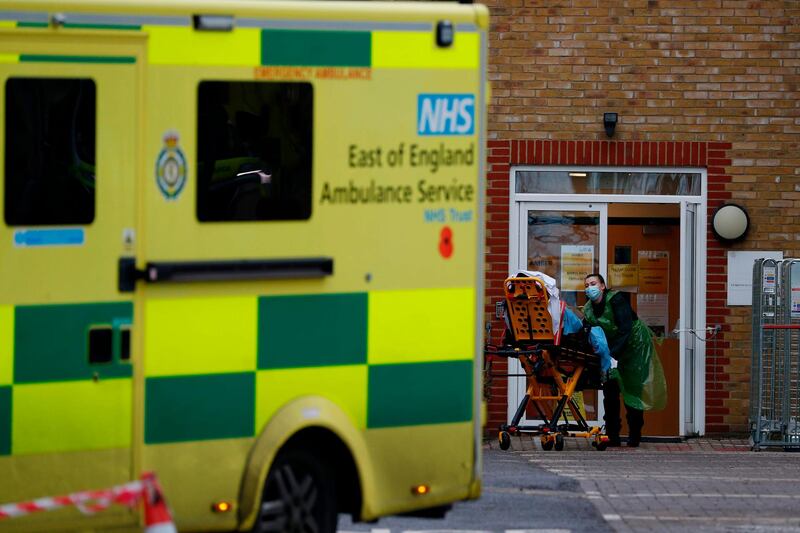 A patient is wheeled in to Southend University Hospital in Essex. AFP