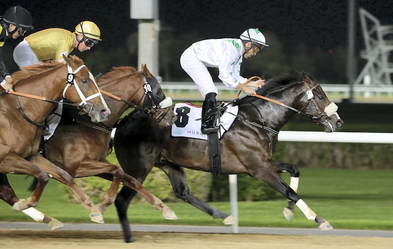 DUBAI , UNITED ARAB EMIRATES , Dec 19  – 2019 :- Fernando Jara ( no 8) guides Dubai Avenue (IRE)  to win the 3rd horse race Strata trophy 1600m dirt at the Meydan Racecourse in Dubai. ( Pawan Singh / The National ) For Sports. Story by Amith