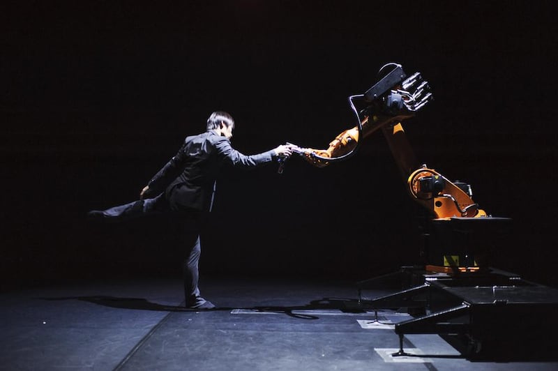 Huang Yi rehearses with robot Kuka, which has become like an extension of the Taiwanese choreographer. Photo by Jacob Blickenstaff 