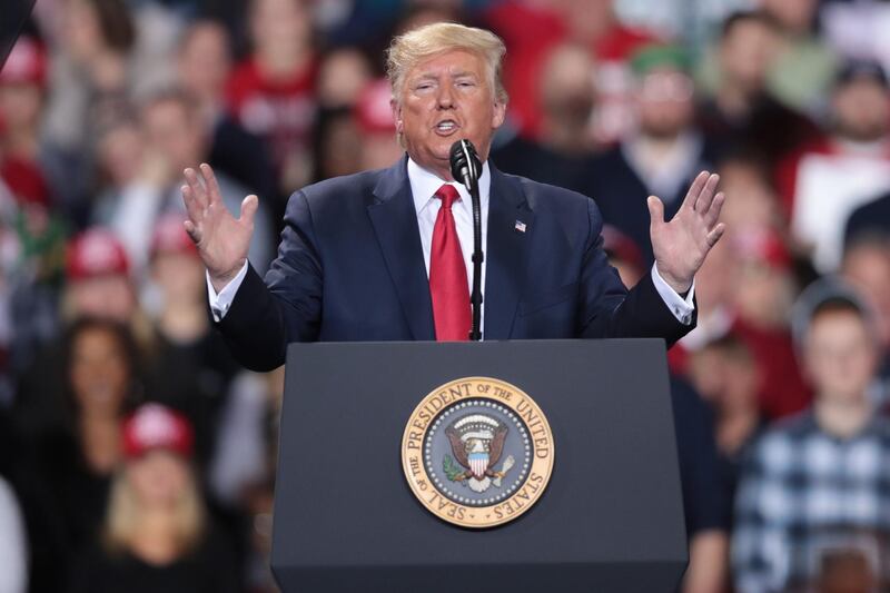 BATTLE CREEK, MICHIGAN - DECEMBER 18: President Donald Trump addresses his impeachment after learning how the vote in the House was divided during a Merry Christmas Rally at the Kellogg Arena on December 18, 2019 in Battle Creek, Michigan. While Trump spoke at the rally the House of Representatives voted, mostly along party lines, to impeach the president for abuse of power and obstruction of Congress, making him just the third president in U.S. history to be impeached.   Scott Olson/Getty Images/AFP
== FOR NEWSPAPERS, INTERNET, TELCOS & TELEVISION USE ONLY ==
