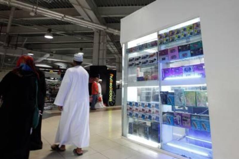 Dubai, 21st June 2011.  Some fake branded electronic communication products and gadgetry can be found in some of the shops here in Dragon Mart.  (Jeffrey E Biteng / The National)