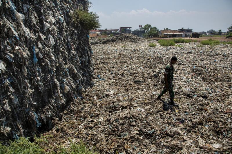 BANDUNG, JAVA, INDONESIA - AUGUST 28: 20 years worth of plastic trash fished out of the Citarum river sits at a dumpsite now being monitored by the Indonesian Army on August 28, 2018 outside Bandung, Java, Indonesia. Despite its being named the worlds most polluted river by the World Bank, around 28 million people in Indonesia depend on the Citarum River for irrigation, electricity, as well as nearly 80 percent of the capital city's water supply. Based on reports, more than 20,000 tons of waste and 340,000 tons of wastewater are disposed of directly into the waterways of the third-biggest river in Java everyday from thousands of textile factories, killing nearly 60 percent of the rivers fish species and causing health problems for people living along the polluted river. In recent years, the Indonesian government has vowed to clean the Citarum river as studies from environmental groups had found that levels of lead in the Citarum River reached 1,000 times worse than the U.S. standards for drinking water, but the problem has persisted due to the lack of coordination, maintenance and enforcement. (Photo by Ed Wray/Getty Images)