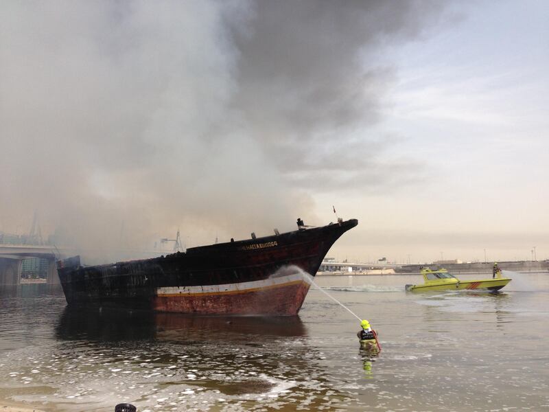 Two boats on fire in Jedaf on Dubai Creek this morning at about 9am. One of the vessels is believed to be a cargo launch. Two explosions were heard by passers-by and thick plumes of smoke could be seen from the Business Bay Crossing nearby. Civil Defence said fire crews were trying to extinguish the flames. (The National- Antonie Robertson)
