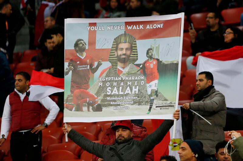 Egypt's fans hold up a poster with an image of  Mohamed Salah during the international friendly football match between Egypt and Greece at the Letzigrund stadium in Zurich on March 27, 2018. Michele Limina / AFP