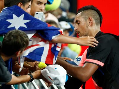 Tennis - Australian Open - Hisense Arena, Melbourne, Australia, January 17, 2018. Nick Kyrgios of Australia signs autographs after winning against Viktor Troicki of Serbia. REUTERS/Thomas Peter