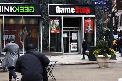 NEW YORK, NEW YORK - JANUARY 27: People walk past a GameStop store in Midtown Manhattan on January 27, 2021 in New York City. Stock shares of videogame retailer GameStop Corp has increased 700% in the past two weeks due to amateur investors.   Michael M. Santiago/Getty Images/AFP
== FOR NEWSPAPERS, INTERNET, TELCOS & TELEVISION USE ONLY ==
