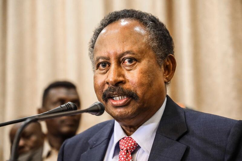 FILE - In this Aug. 21, 2019 file photo, Sudan's new Prime Minister Abdalla Hamdok speaks during a press conference in Khartoum, Sudan. Sudanâ€™s transitional government has announced a major Cabinet reshuffle, hoping to defuse public discontent over collapse of the economy and other crises that have tested the countryâ€™s path toward democracy. Hamdok on Thursday, July 9, 2020 accepted the resignation of six ministers, including the finance minister who has been faulted for failing to rescue the plunging economy. (AP Photo, File)