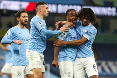 epa08753517 Raheem Sterling (2-R) of Manchester City celebrates with teammates after scoring the opening goal during the English Premier League soccer match between Manchester City and Arsenal FC in Manchester, Britain, 17 October 2020. EPA/Martin Rickett / POOL EDITORIAL USE ONLY. No use with unauthorized audio, video, data, fixture lists, club/league logos or 'live' services. Online in-match use limited to 120 images, no video emulation. No use in betting, games or single club/league/player publications.