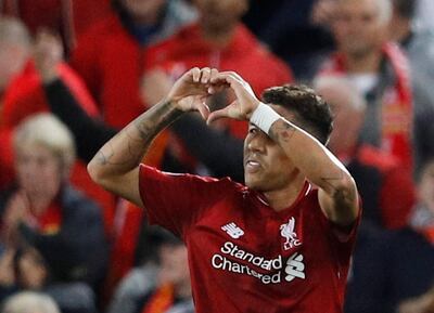 Soccer Football - Champions League - Group Stage - Group C - Liverpool v Paris St Germain - Anfield, Liverpool, Britain - September 18, 2018  Liverpool's Roberto Firmino celebrates scoring their third goal   REUTERS/Phil Noble