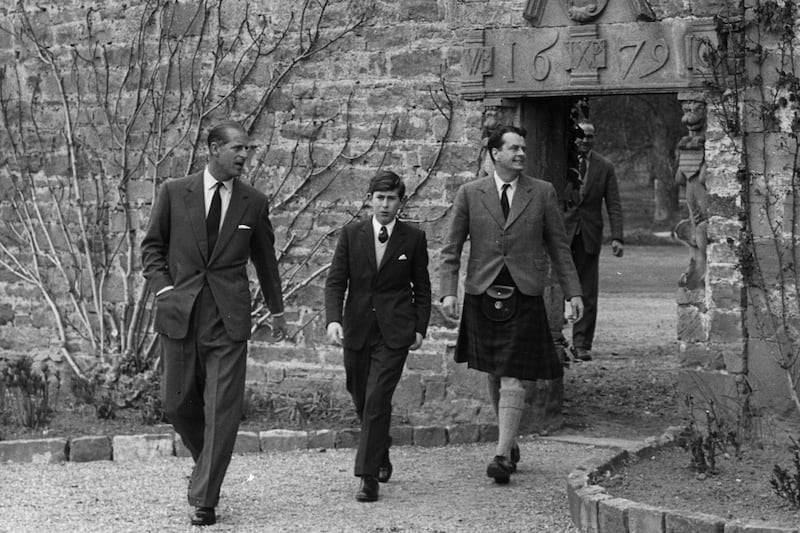 May 1, 1962, Prince Charles arrives for his first term at Gordonstoun school in Moray, Scotland, accompanied by his father Prince Philip, left, and Captain Iain Tennant of the school's board of governors. All photos: Getty Images
