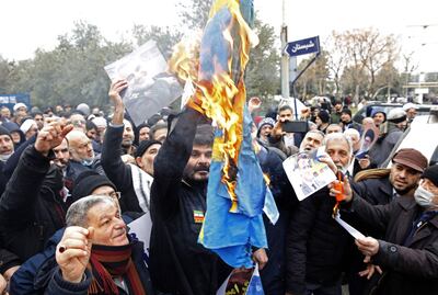 Iranians burn a Swedish flag during a protest in Tehran following the burning of a Quran in Stockholm. AFP