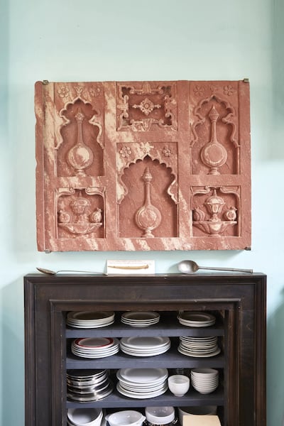 Hodgkin's carefully displayed collection of antique procelain and a Mughal Chini Kana Panel from Agra, circa 1620. A Chini Khana was an architectural element
often used in Mughal garden design comprising a series of sandstone walls such as the present example which were carved with recessed niches of varied forms on which oil lamps or floral vases could be placed. The term ‘Chini Khana’ itself can be translated as ‘China Cabinet’. Sotheby's