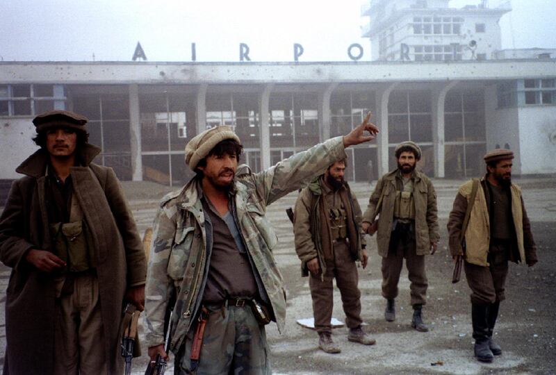 Afghan government soldiers explains about the fighting outside the Kabul airport on January 5