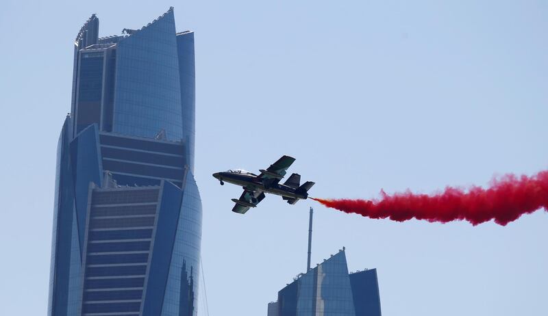 The Al Fursan  National Aerobatic Team perform a fly-by. AFP