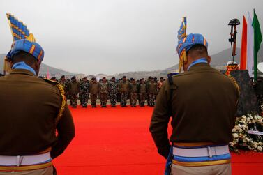 Indian paramilitary soldiers pay tribute at memorial during a ceremony to mark the first anniversary since the deadly Pulwama attack. EPA