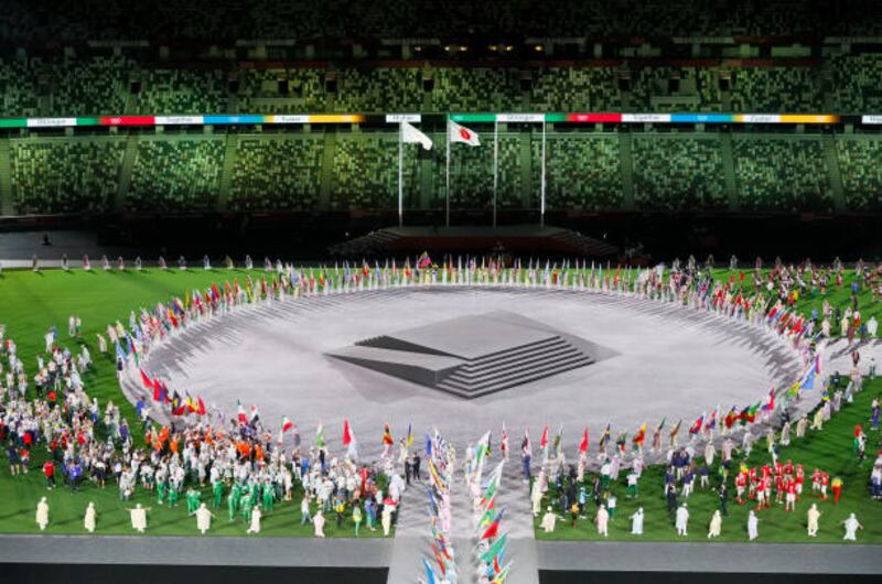 Flag bearers of the competing nations enter the stadium during the closing ceremony.