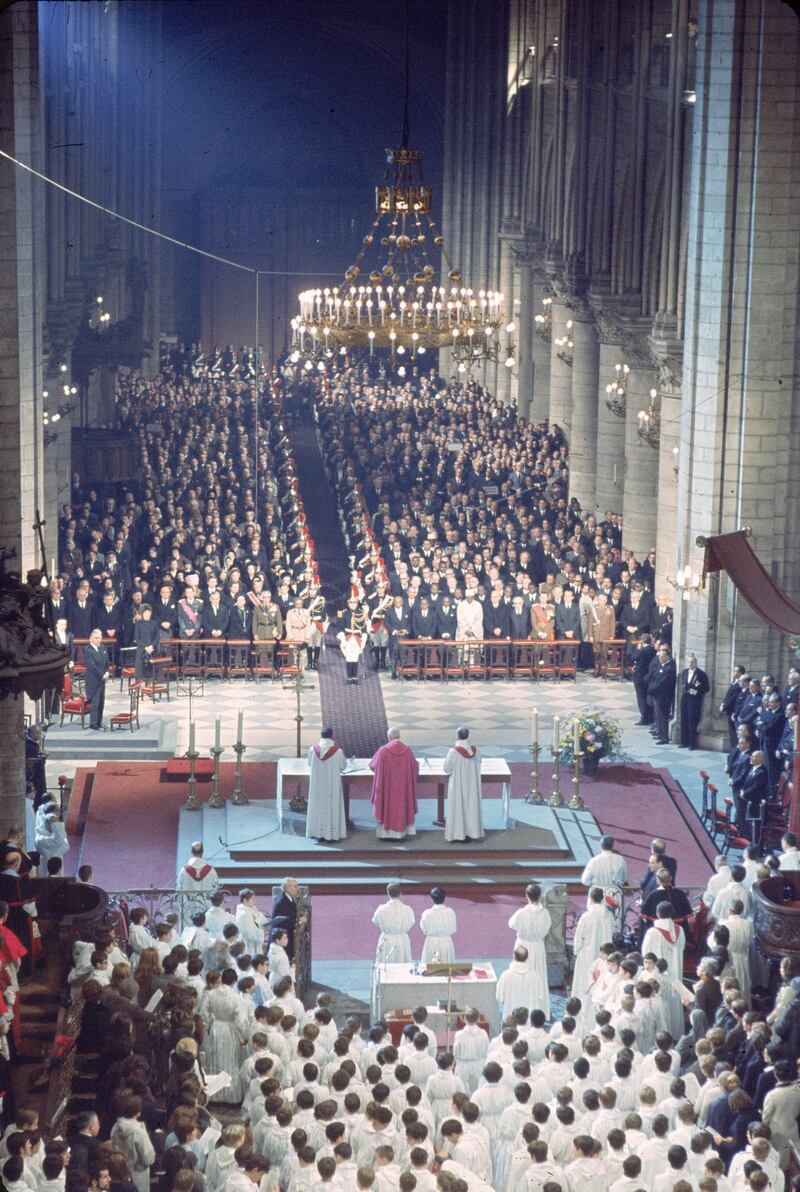 High angle view of the memorial service for late former French President General Charles de Gaulle (1890 - 1970) in Notre Dame Cathedral, Paris, France, November 12, 1970. Rows of dignitaries and soldiers stand at attention as Catholic religious leaders conduct the service from the altar. French president Georges Pompidou (1911 - 1974) stands at left. First row, starting from fifth left is First row, starting from fifth left, King Baudouin of Belgium (1930 - 1993), unidentified, Prince Rainier III of Monaco (1923 ¬ø 2005), Queen Juliana of the Netherlands (1909 ¬ø 2004), unidentified, and Emperor Haile Selassie I of Ethiopia (1892 ¬ø 1975). Prince Charles, Prince of Wales stands in the second row, over Selassie¬øs right shoulder. Across the aisle, is President of Madagascar Philibert Tsiranana (1910 - 1978), President of Ivory Coast Felix Houphouet-Boigny (1905 - 1993), Senegalese President Leopold Sedar Senghor (1906 - 2001), President of Niger Hamani Diori (1916 - 1989), Austrian President Franz Jonas (1899 - 1974), Israeli President Zalman Shazar (1889 - 1974), Grand Duke Jean of Luxembourg, American President Richard Nixon (1913 - 1994), and Marshal of Poland Marian Spychalski (1906 - 1980). Since de Gaulle had requested that no presidents or ministers attend his funeral, the memorial was held for statesmen at Notre Dame, while the funeral took place in Colombey-les-Deux-Eglises. (Photo by Pictorial Parade/Getty Images) 