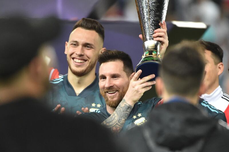 Messi is presented with a cup after Argentina's win, and they have now gone six games without a defeat. AFP