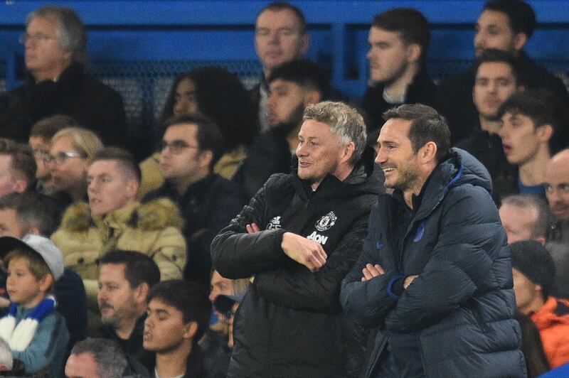 Manchester United's Norwegian manager Ole Gunnar Solskjaer, left, and his Chelsea counterpart Frank Lampard share a joke. AFP