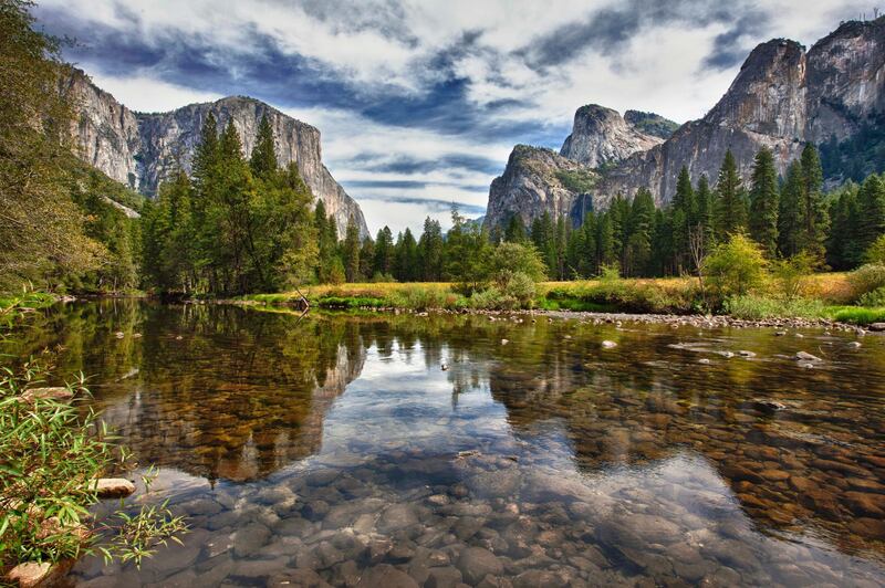 View of Yosemite Valley with Merced River in foreground. Getty Images