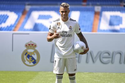 Newly signed Real Madrid soccer player Mariano Diaz poses for the media during his official presentation for Real Madrid at the Santiago Bernabeu stadium in Madrid, Friday, Aug. 31, 2018. (AP Photo/Andrea Comas)