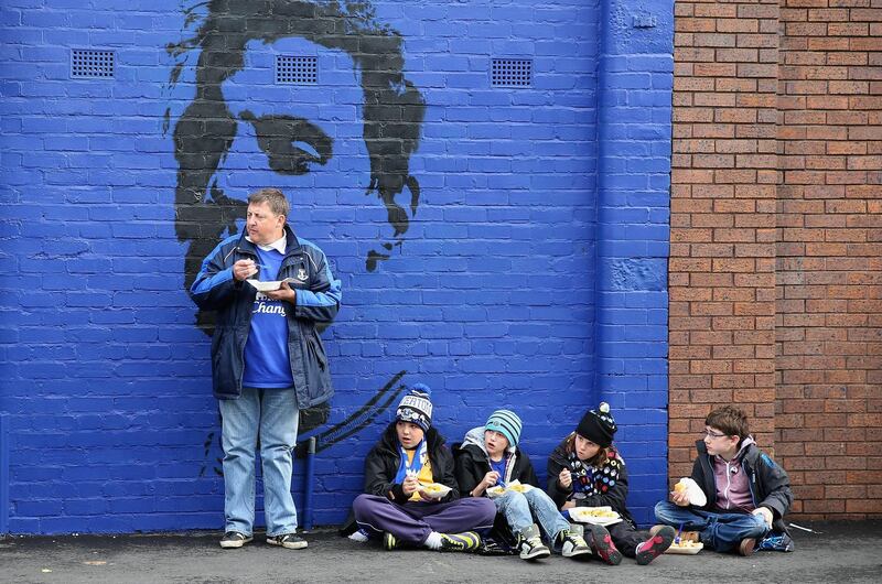 LIVERPOOL, ENGLAND - OCTOBER 19: Young children eat fish and chips at Goodison Park prior to the Barclays Premier League match between Everton and Hull City at Goodison Park on October 19, 2013 in Liverpool, England.  (Photo by Clive Brunskill/Getty Images)