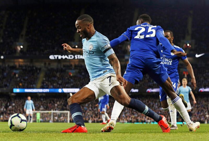 Manchester City forward Raheem Sterling dribbles past Leicester City midfielder Wilfred Ndiddi. EPA