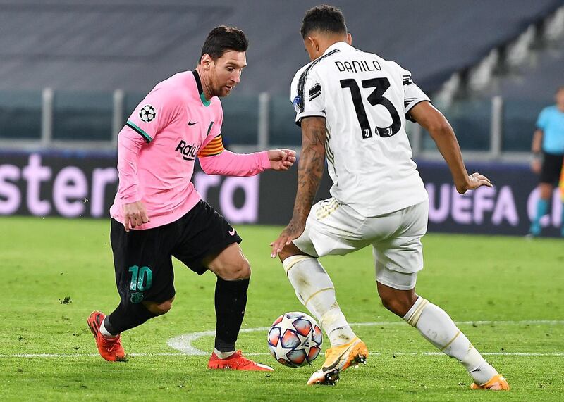 Juventus' Danilo and Barcelona's Lionel Messi in action. EPA