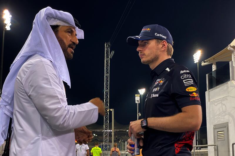 Red Bull driver Max Verstappen, right, speaks with Mohammed Ben Sulayem, ahead of the F1 Grand Prix of Abu Dhabi at Yas Marina Circuit on November 17, 2022. AP Photo