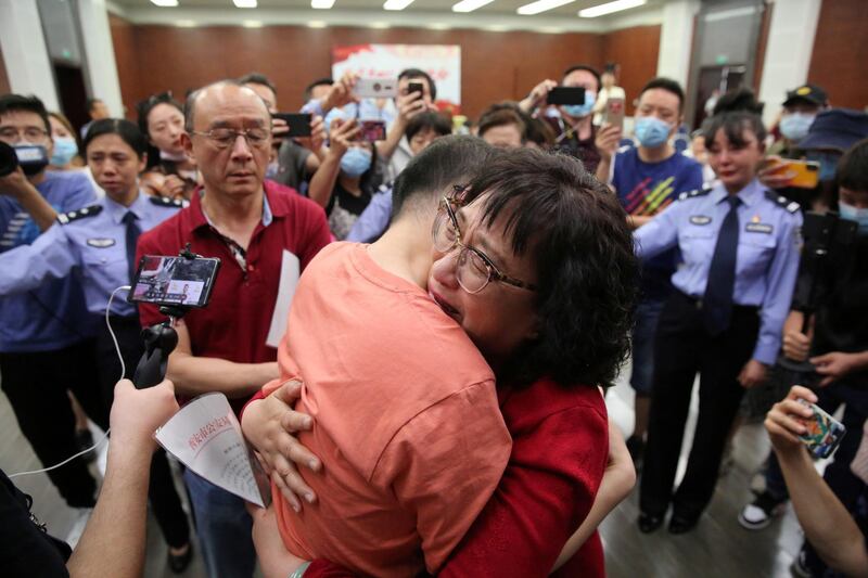 Mao Yin embraces his mother Li Jingzhi as he reunites with his parents for the first time since his parents lost him at a hotel 32 years ago, at the public security bureau in Xian, Shaanxi province, China. Reuters