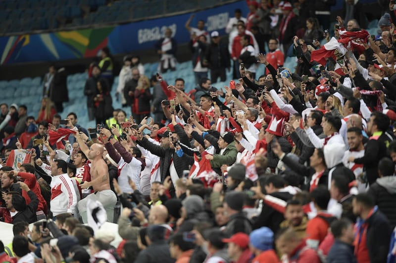 Fans of Peru celebrate after defeating Chile 3-0 in their Copa America football tournament semi-final match at the Gremio Arena in Porto Alegre, Brazil.  AFP