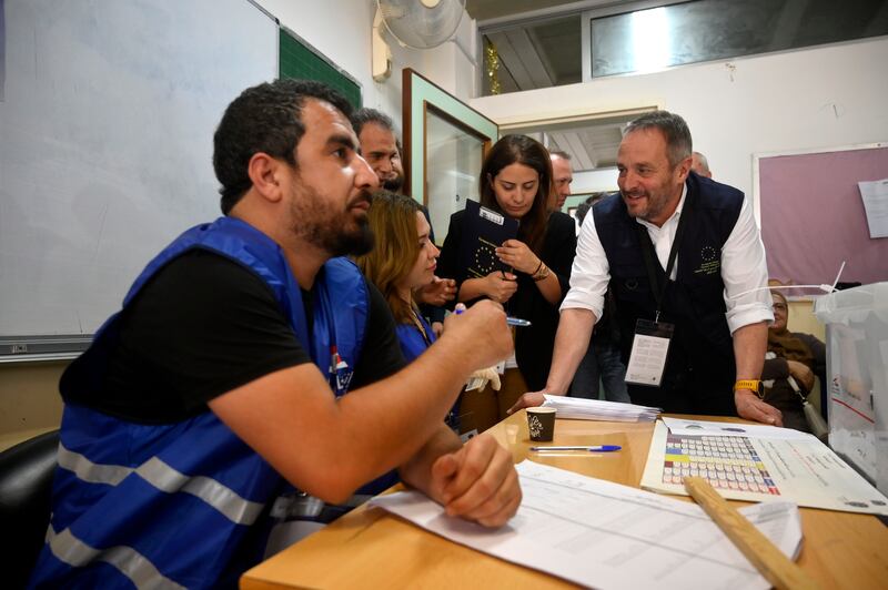 Gyorgy Holvenyi (R), chief observer of the European Union election observation mission, visits a polling station in Beirut. EPA