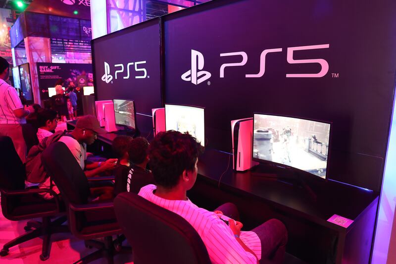 Attendees take part in light-hearted gaming tournaments including this one on the PlayStation 5