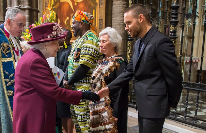 Queen Elizabeth meets British singer Liam Payne at Westminster Abbey. Getty