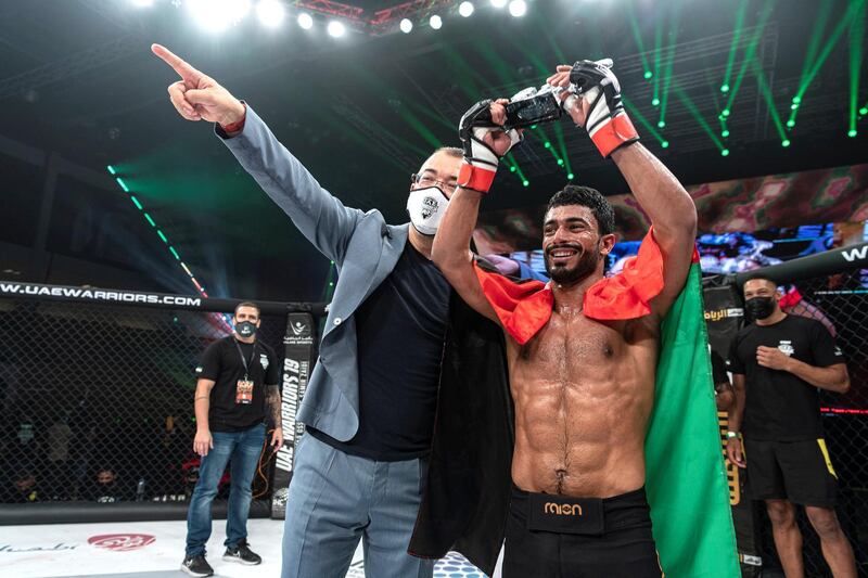 Omar Al Hussaini celebrates his debut win with Fouad Darwish, managing director of Palms Sports, in the UAE Warriors 19 Arabia 3 at the Jiu-Jitsu Arena on Friday, June 18, 2021. Courtesy UAE Warriors