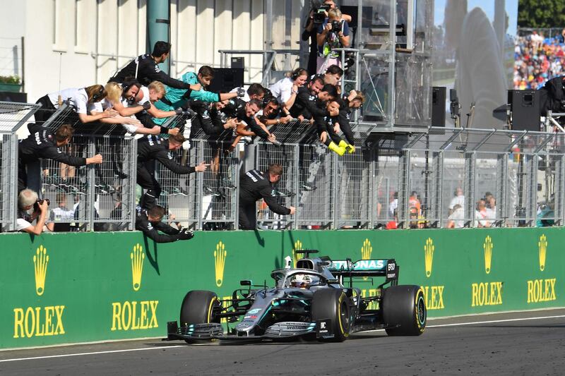 Lewis Hamilton crosses the line to win the Hungarian Grand Prix. AFP