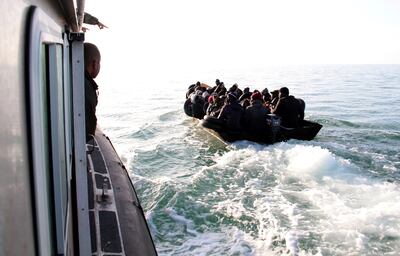 Migrants, mainly from sub-Saharan Africa, are stopped by Tunisian Maritime National Guard. AP