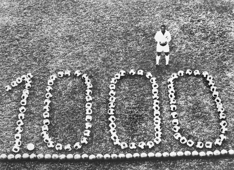 BRAZIL - DECEMBER 12:  PELE, the famous Brazilian football player celebrating his 1000th goal in front of the triumphant number formed by footballs.  (Photo by Keystone-France/Gamma-Keystone via Getty Images)