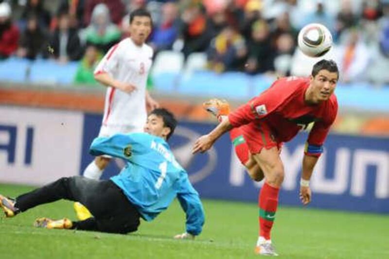 Cristiano Ronaldo, right, rounds Ri Myong-guk to score his first goal for Portugal in two years during their 7-0 thrashing of North Korea.