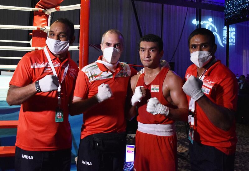 Indian boxer Shiva Thapa (second from right) celebrates after his quarterfinal win with his technical staff at the ASBA Asian Boxing Championship at the Le Meridien Grand Ballroom in Dubai on Tuesday, May 25, 2021. Courtesy BFI