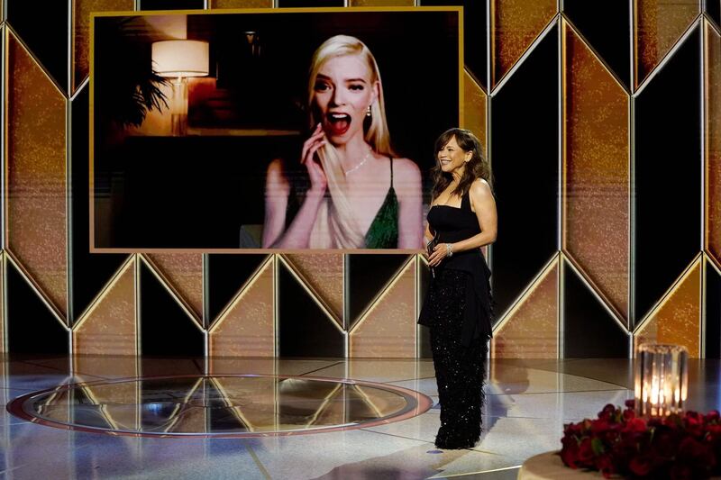 Anya Taylor-Joy (on screen), winner of the Best Actress - Television Motion Picture award for 'The Queen's Gambit' reacts as Rosie Perez presents onstage at the 78th Annual Golden Globe Awards. AFP / NBCUniversal