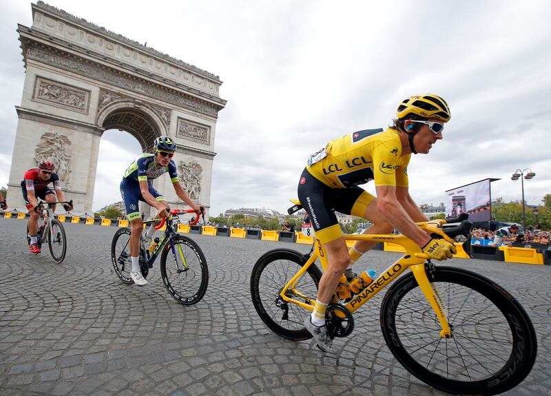 Thomas passes the Arc de Triomphe in the peloton. Reuters