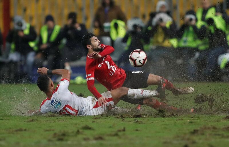 Al Ahly's Ayman Ashraf in action with El Zamalek's Youssef Obama. Reuters