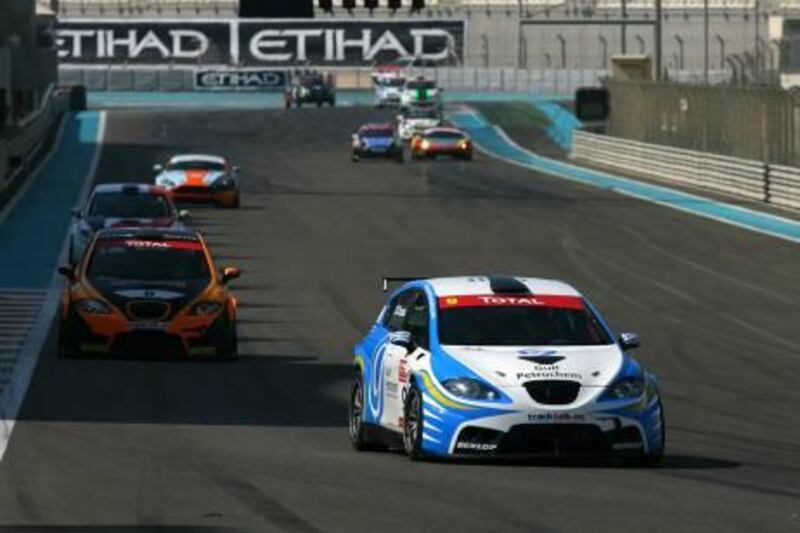 Costas Papantonis (Gulf Petrochem) SEAT leads the pack on his way to victory in the Total UAE Touring Cars race one at Yas Marina Circuit.

Courtesy Dubai Autodrome.