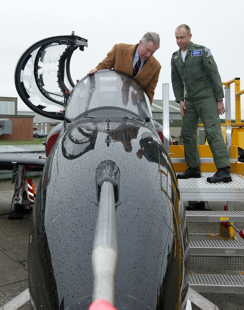 Prince Charles climbs onboard the latest Hawk training jet during a visit to RAF Valley in 2009 in Holyhead, Wales