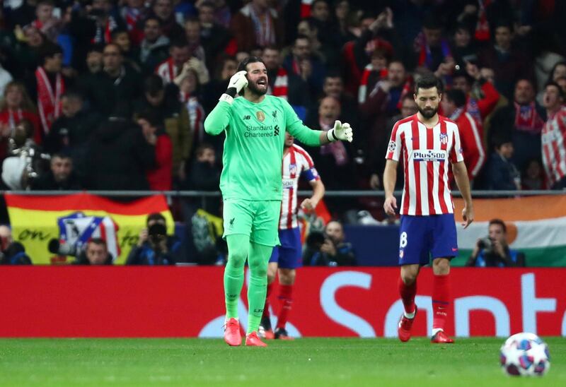 Liverpool's Alisson reacts after conceding their first goal. Reuters