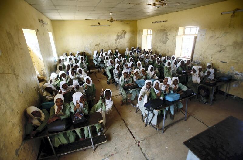 Sudanese girls sit in a classroom at the El-Riyadh camp for internally displaced persons (IDP) in Geneina, the capital of the state of Sudan's West Darfur, on February 8, 2017. (Photo by ASHRAF SHAZLY / AFP)