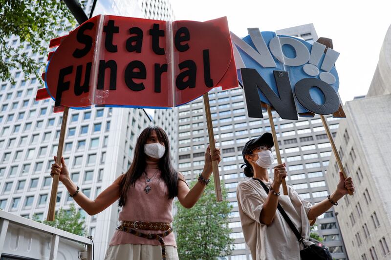 People make clear their feelings about the state funeral. Reuters