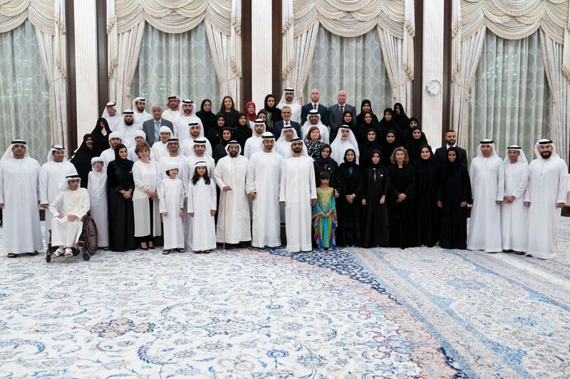 ABU DHABI, UNITED ARAB EMIRATES - May 21, 2019: HH Sheikh Mohamed bin Rashid Al Maktoum, Vice-President, Prime Minister of the UAE, Ruler of Dubai and Minister of Defence (front row 10th R), HH Sheikh Mohamed bin Zayed Al Nahyan, Crown Prince of Abu Dhabi and Deputy Supreme Commander of the UAE Armed Forces (front row 11th R), HH Sheikh Tahnoon bin Mohamed Al Nahyan, Ruler's Representative in Al Ain Region (front row 12th R) and HH Sheikh Hamdan bin Mohamed Al Maktoum, Crown Prince of Dubai (front row 13th R) stand for a photograph with members of Adheedak Group, during an iftar reception at Al Bateen Palace. Seen with HE Jameela Salem Al Muhairi, UAE Minister of State for Public Education Affairs (front row 9th R).

( Eissa Al Hammadi for the Ministry of Presidential Affairs )
---