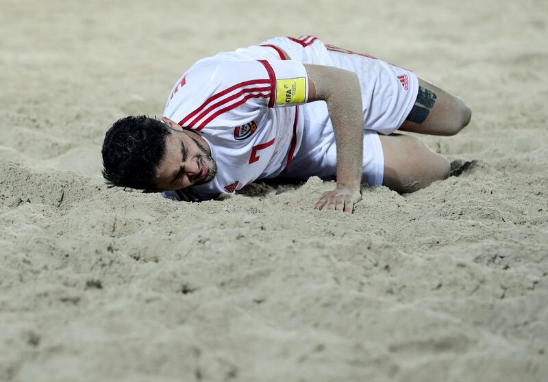 Dubai, United Arab Emirates - November 05, 2019: The UAE's Hexham Muntaser is injured during the game between the UAE and Spain during the Intercontinental Beach Soccer Cup. Tuesday the 5th of November 2019. Kite Beach, Dubai. Chris Whiteoak / The National